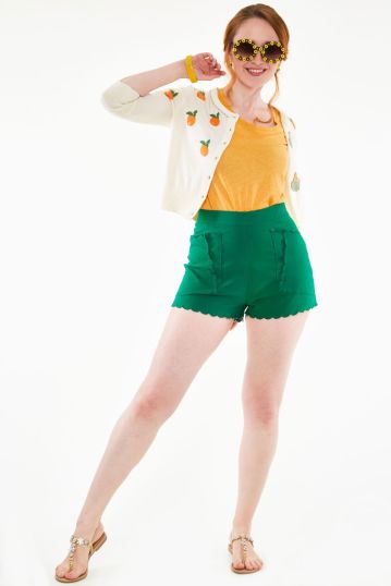 High waisted green shorts with embroidered scallop pocket detail